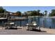 Lakeside seating area overlooking tranquil waters, offering a perfect spot for relaxation and enjoying the outdoors at 20426 N Alma Dr, Maricopa, AZ 85138