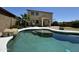 Gorgeous swimming pool and patio area in a lush, green backyard. Great for outdoor entertaining at 20426 N Alma Dr, Maricopa, AZ 85138