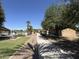 Scenic walkway lined with trees connects the pool to the picnic pavilions at 20426 N Alma Dr, Maricopa, AZ 85138