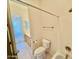 Bright bathroom features a tiled floor, toilet, and a shower and bathtub combination at 20472 W Daniel Pl, Buckeye, AZ 85396
