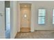 Bright entryway showcases a rounded door with window and an open view to the living spaces at 20472 W Daniel Pl, Buckeye, AZ 85396