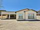 Charming stucco home featuring a tile roof, neutral trim, and a covered patio for outdoor entertaining at 20472 W Daniel Pl, Buckeye, AZ 85396