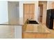 Kitchen island featuring granite countertops and a black sink and faucet at 20472 W Daniel Pl, Buckeye, AZ 85396
