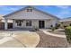 Exterior view of a home's covered patio and manicured backyard, perfect for entertaining at 21616 E Calle De Flores --, Queen Creek, AZ 85142