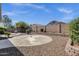 A private backyard featuring thoughtfully manicured landscaping and a fountain at 21616 E Calle De Flores --, Queen Creek, AZ 85142