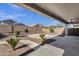 Relaxing backyard featuring a covered patio, desert landscaping, and a circular patio area at 21616 E Calle De Flores --, Queen Creek, AZ 85142