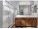Bright bathroom featuring double sink vanity, spacious shower and a well lit, large mirror at 21616 E Calle De Flores --, Queen Creek, AZ 85142