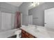 Well-lit bathroom featuring a vanity, double sinks, and a shower and tub combination at 21616 E Calle De Flores --, Queen Creek, AZ 85142
