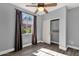 Relaxing bedroom boasts a ceiling fan, closet with ample storage, and a sunny window at 21616 E Calle De Flores --, Queen Creek, AZ 85142