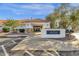 Community clubhouse showcasing a welcoming entrance, manicured landscaping, and convenient parking at 21616 E Calle De Flores --, Queen Creek, AZ 85142