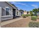 Charming single-story home with desert landscaping and a welcoming entrance under a bright blue sky at 21616 E Calle De Flores --, Queen Creek, AZ 85142