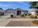 Charming single-story home featuring desert landscaping and a two-car garage in a well-maintained community at 21616 E Calle De Flores --, Queen Creek, AZ 85142