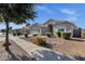 Charming single-story home featuring desert landscaping and a two-car garage in a well-maintained community at 21616 E Calle De Flores --, Queen Creek, AZ 85142