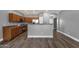 Kitchen showcasing wood cabinets, breakfast bar, and stainless-steel appliances at 21616 E Calle De Flores --, Queen Creek, AZ 85142