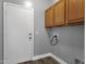 Practical laundry area featuring overhead cabinets, hookups and ample room for chores at 21616 E Calle De Flores --, Queen Creek, AZ 85142