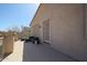 This spacious balcony has a sliding glass door entry and has a small outdoor seating area at 23104 W Kimberly Dr, Buckeye, AZ 85326