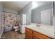 Standard bathroom featuring a single sink vanity and a lighthouse-themed shower curtain at 23104 W Kimberly Dr, Buckeye, AZ 85326