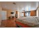 Bright primary bedroom featuring two beds, wood floors, and natural light at 23104 W Kimberly Dr, Buckeye, AZ 85326