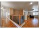 Bright hallway with wood floors leads to the living area at 23104 W Kimberly Dr, Buckeye, AZ 85326