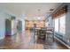 Open kitchen and dining area featuring tile floors, a kitchen island, and stainless steel appliances at 23104 W Kimberly Dr, Buckeye, AZ 85326