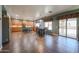 Open kitchen and dining area featuring tile floors, a kitchen island, and stainless steel appliances at 23104 W Kimberly Dr, Buckeye, AZ 85326