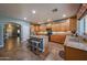 Large kitchen featuring wooden cabinets, granite countertops, an island, and stainless steel appliances at 23104 W Kimberly Dr, Buckeye, AZ 85326