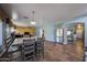 Open concept layout connects the kitchen, dining, and living areas with tile floors throughout at 23104 W Kimberly Dr, Buckeye, AZ 85326