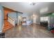 Spacious living room showcasing tile flooring and an open layout with a staircase to the left at 23104 W Kimberly Dr, Buckeye, AZ 85326