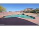 Backyard swimming pool featuring rock waterfall and a surrounding patio area at 23104 W Kimberly Dr, Buckeye, AZ 85326