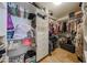 This walk-in closet has built-in shelving and hanging racks for optimal organization at 23104 W Kimberly Dr, Buckeye, AZ 85326