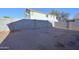Large backyard with a block fence for privacy and clear blue skies. Great space for customization! at 2667 S 156Th Ave, Goodyear, AZ 85338