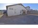 The exterior view of the home shows a spacious backyard with potential for outdoor living and entertaining at 2667 S 156Th Ave, Goodyear, AZ 85338