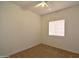 Bedroom featuring beige carpet, a ceiling fan, and a window with blinds at 2667 S 156Th Ave, Goodyear, AZ 85338