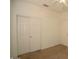 Neutral bedroom with a ceiling fan, closet with sliding doors, and neutral carpet at 2667 S 156Th Ave, Goodyear, AZ 85338