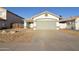 Charming single-story home with a two-car garage and low-maintenance desert landscaping at 2667 S 156Th Ave, Goodyear, AZ 85338