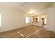 Spacious living area with updated laminate flooring and views into the adjacent kitchen and dining area at 2667 S 156Th Ave, Goodyear, AZ 85338