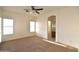 Main bedroom with carpet, ceiling fan, and en suite bathroom at 2667 S 156Th Ave, Goodyear, AZ 85338