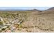 Aerial view of houses and desert landscape with hiking trails and mountain views at 3020 E Mission Ln, Phoenix, AZ 85028