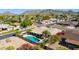 Aerial view of backyard pool with covered patio, desert landscaping and mountain views at 3020 E Mission Ln, Phoenix, AZ 85028