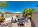 Inviting backyard with pool, patio, seating, and a lush desert landscape under a blue sky at 3020 E Mission Ln, Phoenix, AZ 85028