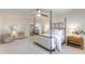Bright bedroom features a four-poster bed, a ceiling fan, an ensuite and comfortable seating at 3020 E Mission Ln, Phoenix, AZ 85028