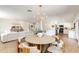 Open-concept dining area adjacent to modern kitchen and living room at 3020 E Mission Ln, Phoenix, AZ 85028