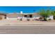 Charming home featuring desert landscaping, an attached garage, and a welcoming front entrance at 3020 E Mission Ln, Phoenix, AZ 85028