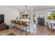 Kitchen features bar seating, stainless appliances and white cabinetry at 3020 E Mission Ln, Phoenix, AZ 85028