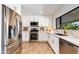 Modern kitchen with stainless steel appliances and quartz countertops at 3020 E Mission Ln, Phoenix, AZ 85028