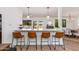 Kitchen features bar seating, stainless appliances and white cabinetry at 3020 E Mission Ln, Phoenix, AZ 85028