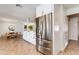 Kitchen features stainless steel fridge and open floor plan at 3020 E Mission Ln, Phoenix, AZ 85028