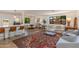 Open-concept living area with bar seating, dining space, and access to the backyard at 3020 E Mission Ln, Phoenix, AZ 85028
