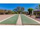 Outdoor shuffleboard court in community with desert landscaping and trees at 3020 E Mission Ln, Phoenix, AZ 85028