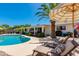 Great view of the pool, patio, palm tree, and lounge chairs in a backyard oasis at 3020 E Mission Ln, Phoenix, AZ 85028